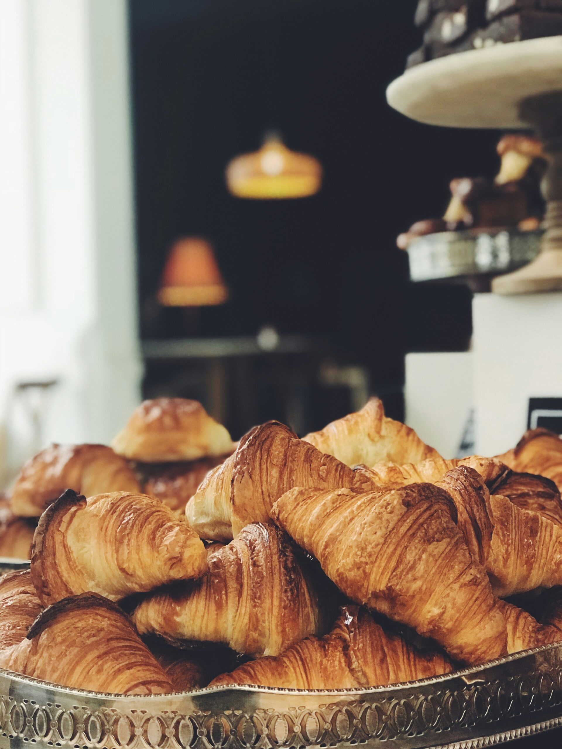 croissant on top of stainless steel tray